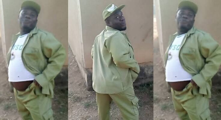 Male INEC Corps Member shows Off Protruding Abdomen in Undersized White T-shirt