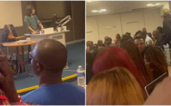 White teacher pronounces series of Yoruba students names while marking attendance.