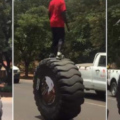 Cool stunt or death warrant? – Man rides tractor tyre on expressway, dares to skip on it