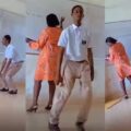 Bold student dances in front of class as teacher writes on the board | Ikejabird.com