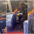 African man enjoys swallow and draw soup in a UK bus