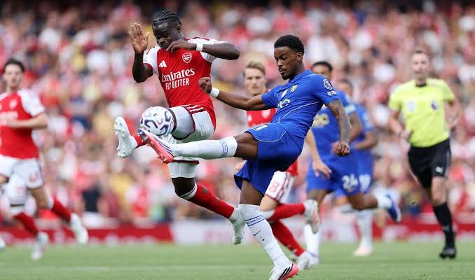 Arsenal players celebrate their 2-1 win over Chelsea in the Premier League