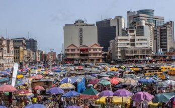 People out on a Lagos street as they navigate the city's busy urban lifestyle.