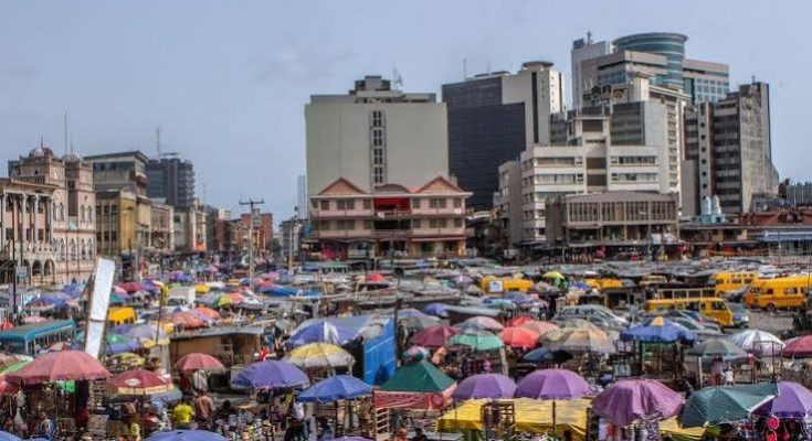 People out on a Lagos street as they navigate the city's busy urban lifestyle.