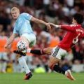 Manchester United and Manchester City players during the Manchester Derby