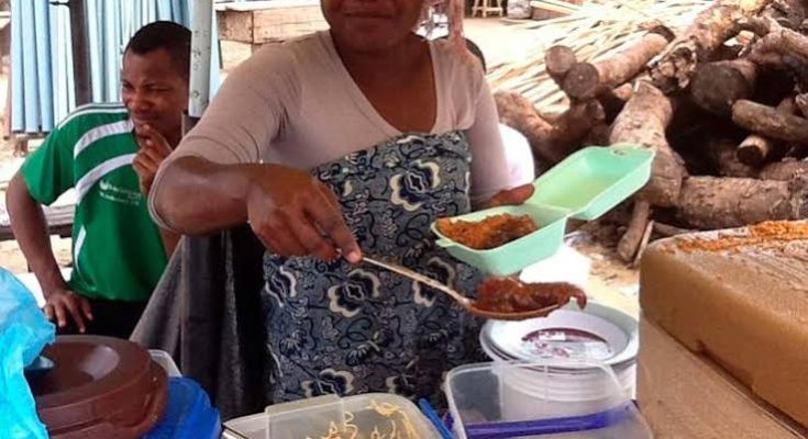 Roadside traders operating along a Lagos street
